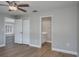Bedroom view featuring closet, bathroom and shuttered window at 9500 Green Needle Dr, New Port Richey, FL 34655