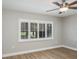 Bedroom features shuttered window and ceiling fan at 9500 Green Needle Dr, New Port Richey, FL 34655