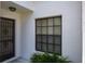Close up of an entryway with security door at 9500 Green Needle Dr, New Port Richey, FL 34655