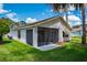 Home featuring a screened in lanai and an updated exterior at 9500 Green Needle Dr, New Port Richey, FL 34655