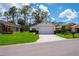 Single story home with a well manicured front lawn at 9500 Green Needle Dr, New Port Richey, FL 34655
