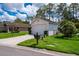 Single story house with green lawn and an attached two-car garage at 9500 Green Needle Dr, New Port Richey, FL 34655