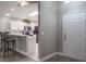 Modern kitchen featuring an open layout with countertop seating and stainless steel appliances at 9500 Green Needle Dr, New Port Richey, FL 34655