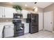 Renovated kitchen boasting stainless steel appliances and white cabinets for a modern appeal at 9500 Green Needle Dr, New Port Richey, FL 34655