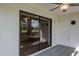 Close up of lanai with view into house through sliding glass doors at 9500 Green Needle Dr, New Port Richey, FL 34655