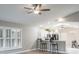 Open living area shows kitchen, ceiling fan and breakfast bar at 9500 Green Needle Dr, New Port Richey, FL 34655
