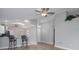 View of open living room with bar stools and vaulted ceilings at 9500 Green Needle Dr, New Port Richey, FL 34655