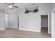 Bright and open living room featuring a ceiling fan, vaulted ceiling and new vinyl flooring at 9500 Green Needle Dr, New Port Richey, FL 34655