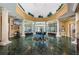 Elegant community center lobby with soaring ceilings, marble floors, and grand piano at 9500 Green Needle Dr, New Port Richey, FL 34655