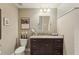 Bathroom features granite counters, dark cabinets, and a walk-in shower with white subway tile at 1014 7Th Street N, St Petersburg, FL 33701