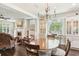 Elegant dining room with a chandelier and lots of natural light at 1014 7Th Street N, St Petersburg, FL 33701