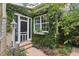 Exterior view showcasing the entrance adorned with climbing plants at 1014 7Th Street N, St Petersburg, FL 33701