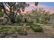 Charming home exterior with manicured landscaping, brick pathway, and a beautiful sunset sky at 1014 7Th Street N, St Petersburg, FL 33701