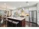 Bright kitchen with a large center island, modern stainless appliances, and views to an adjacent breakfast nook at 1014 7Th Street N, St Petersburg, FL 33701