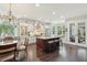Bright kitchen with a large center island, modern stainless appliances, and views to an adjacent breakfast nook at 1014 7Th Street N, St Petersburg, FL 33701