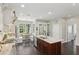 Kitchen with a large breakfast nook and dining area with white trim and large view windows to the backyard at 1014 7Th Street N, St Petersburg, FL 33701