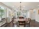 Bright, open kitchen features dark hardwood floors, a large island with seating, and stainless steel appliances at 1014 7Th Street N, St Petersburg, FL 33701