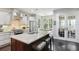 A large kitchen island has an undermount sink, granite counter top, and bar stool seating in this spacious home at 1014 7Th Street N, St Petersburg, FL 33701