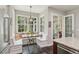 Kitchen nook features large picture window, built-in seating and table in a well-lit breakfast space at 1014 7Th Street N, St Petersburg, FL 33701