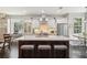 Bright kitchen with a large center island, modern stainless appliances, and views to an adjacent breakfast nook at 1014 7Th Street N, St Petersburg, FL 33701
