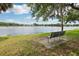 Scenic lake view with a bench, lush greenery, and a peaceful, relaxing atmosphere at 1014 7Th Street N, St Petersburg, FL 33701