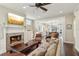 Cozy living room featuring a stone fireplace, hardwood floors, and comfortable seating at 1014 7Th Street N, St Petersburg, FL 33701
