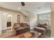 Comfortable living area with vaulted ceiling, a cozy sofa and chair, and an ornate wooden coffee table at 1014 7Th Street N, St Petersburg, FL 33701