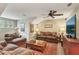 Cozy living room with comfortable seating, fan, and decorative rug at 1014 7Th Street N, St Petersburg, FL 33701