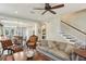Spacious living room with stairs to the second level and open to the kitchen and dining area at 1014 7Th Street N, St Petersburg, FL 33701