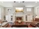 Inviting living room with a stone fireplace, built-in shelves, and comfortable seating at 1014 7Th Street N, St Petersburg, FL 33701