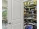Open pantry showing shelves filled with lots of food and household items at 1014 7Th Street N, St Petersburg, FL 33701