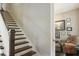 Elegant staircase with dark wood treads and white risers at 1014 7Th Street N, St Petersburg, FL 33701
