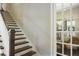 Elegant staircase with dark wood treads and white risers at 1014 7Th Street N, St Petersburg, FL 33701