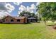A spacious backyard features a screened pool and a shed at 107 Garland Cir, Palm Harbor, FL 34683