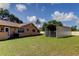 The backyard features a shed and a pool at 107 Garland Cir, Palm Harbor, FL 34683