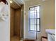 The bathroom features a tiled shower, a window, and a white towel at 107 Garland Cir, Palm Harbor, FL 34683