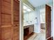 Vintage style bathroom with a wood vanity and plenty of cabinet space at 107 Garland Cir, Palm Harbor, FL 34683