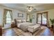 Comfortable bedroom with warm lighting, decorative pillows, and stylish furnishings at 107 Garland Cir, Palm Harbor, FL 34683