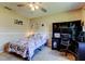 Bright bedroom with carpet, ceiling fan and study space with dark wood desk and matching shelving at 107 Garland Cir, Palm Harbor, FL 34683