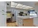 Spacious kitchen boasts an island, stainless appliances, and lots of storage with breakfast nook at 107 Garland Cir, Palm Harbor, FL 34683