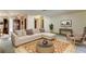 Inviting living room with a large sectional sofa and stylish decor, perfect for relaxing and entertaining at 107 Garland Cir, Palm Harbor, FL 34683
