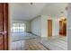 Open living space with carpeted floors, sliding glass doors to the pool, and tile entryway at 107 Garland Cir, Palm Harbor, FL 34683