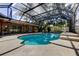 An angular screened pool offers outdoor enjoyment at 107 Garland Cir, Palm Harbor, FL 34683