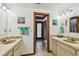 Bathroom with double sinks and matching vanities, a toilet room in the center at 11209 Spring St, Largo, FL 33774