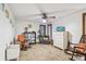 Spacious bedroom featuring neutral carpet, ceiling fan, closet, and rocking chairs at 11209 Spring St, Largo, FL 33774