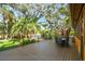 Spacious outdoor deck offering great views of the backyard and lush greenery at 11209 Spring St, Largo, FL 33774