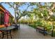 Wide wood deck area provides ample space to enjoy a meal overlooking the expansive wooded yard at 11209 Spring St, Largo, FL 33774