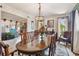 Elegant dining room with large wood table and views into the living room at 11209 Spring St, Largo, FL 33774