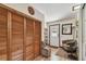 Inviting entryway with closet, chair, accent pieces, and wood-look floors at 11209 Spring St, Largo, FL 33774