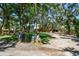 Two story home with a beautiful front yard, mature trees, and mailbox by the drive at 11209 Spring St, Largo, FL 33774